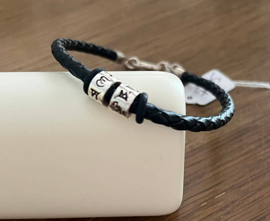 Black leather and silver character bracelet