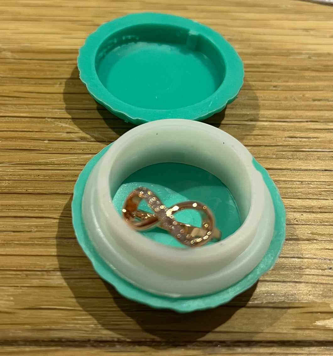 Infinity ring in macaron case